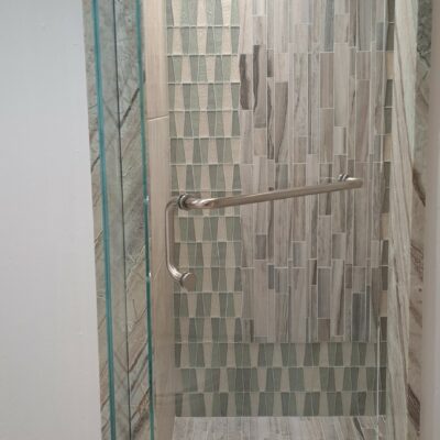 Glass Shower Doors using frameless glass and Metal Hardware