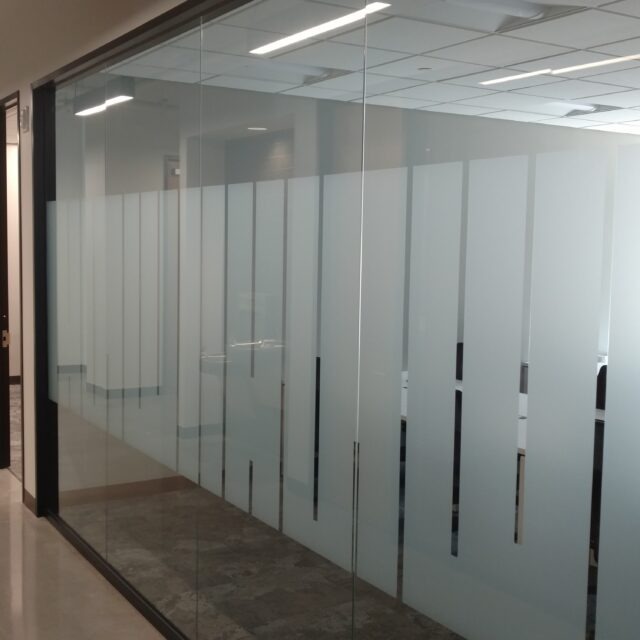 Frameless Glass Office Doors with custom graphics.
