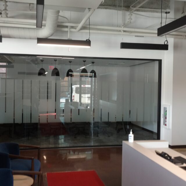 Frameless Glass Office Doors with custom graphics.