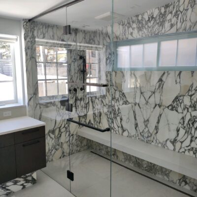 Dual Shower and Glass Enclosure Frameless shower door.