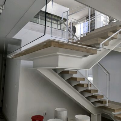 Painted Steele Handrails, Banister, with custom glass inserts Balusters staircase.
