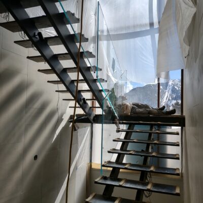 Aspen custom Glass Staircase with Glass Balusters and custom hardware.