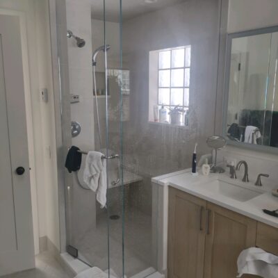 Shower Custom Glass Bathroom Enclosure polished Steele hardware.