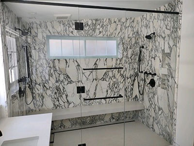 Dual Shower and Glass Enclosure Frameless shower door.